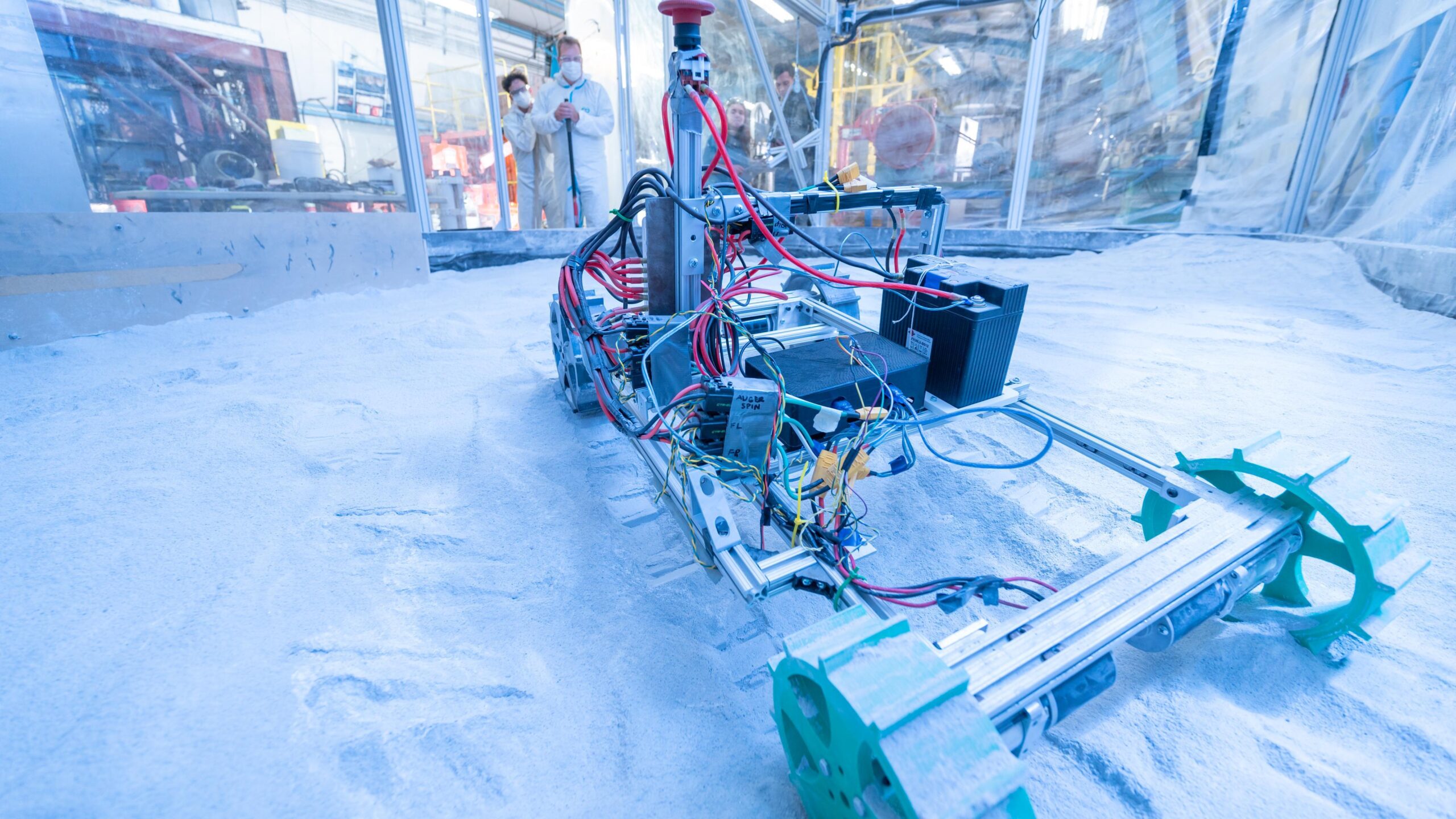 A robot that is sitting in the snow.