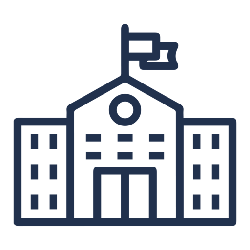 a school building with a flag on top of it.