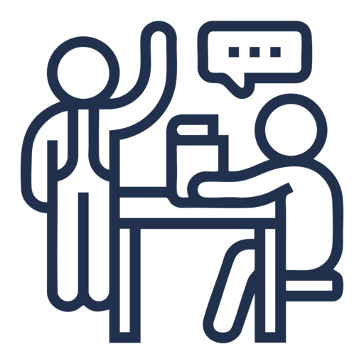 A person sitting at a table with a speech bubble above them.